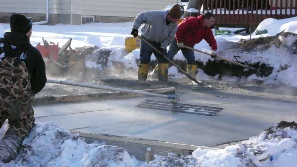 Why does concrete harden slowly in winter?